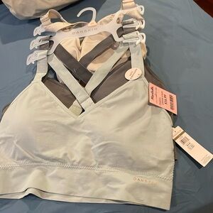 Set of three Danskin cross back bras size 2X, light gray, dark gray, cream
